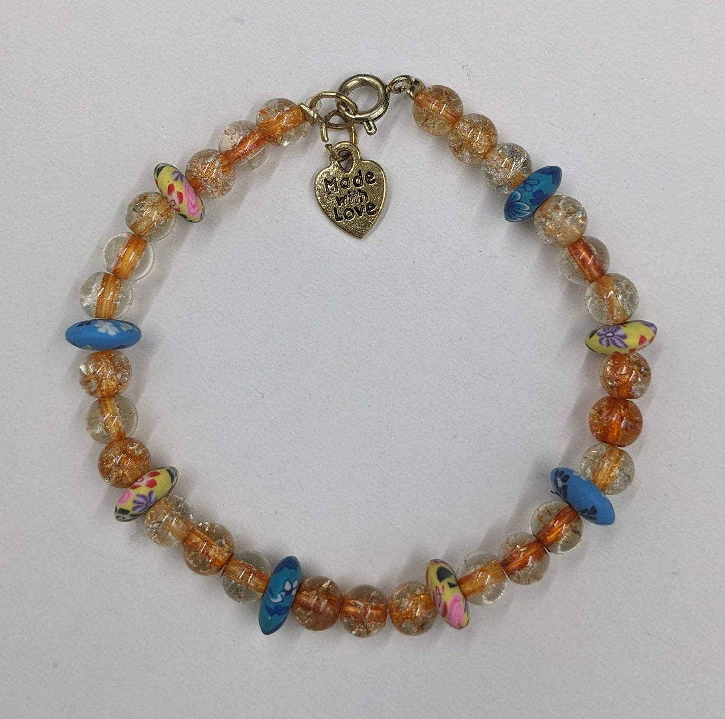 Orange glass beads with floral clay accent beads bracelet
